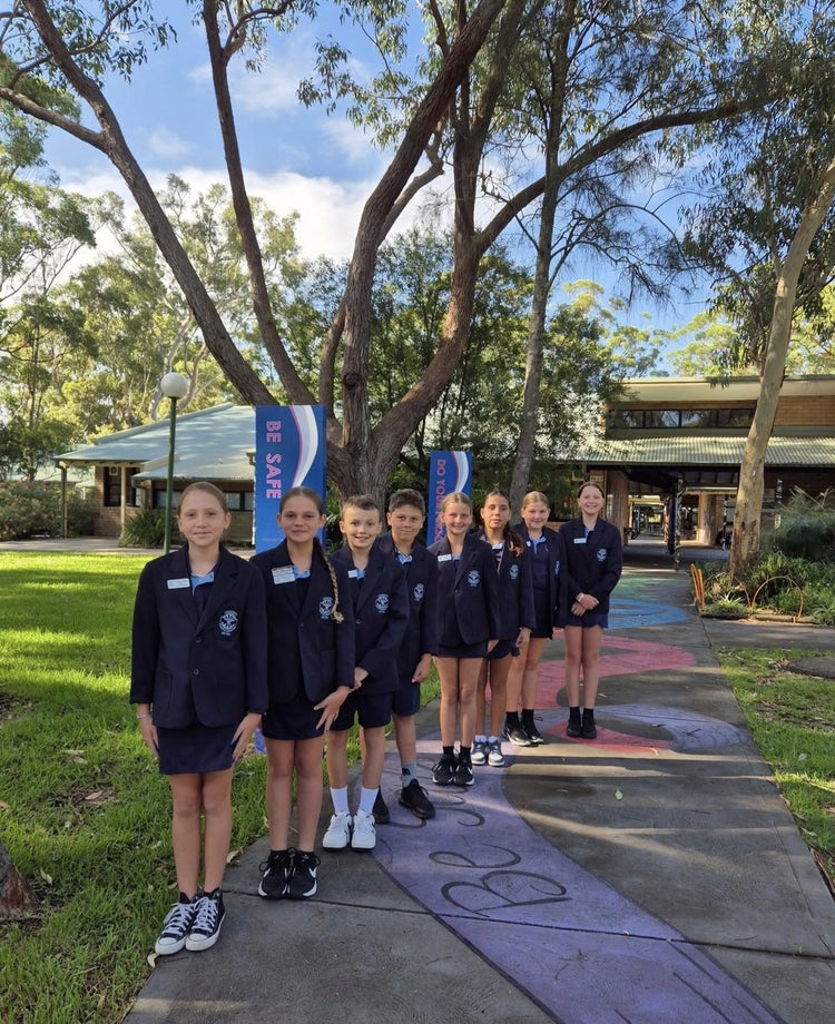 2025 school leaders in front of school