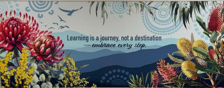 Image of school mural with words Learning is a journey, not a destination - embrace every step.