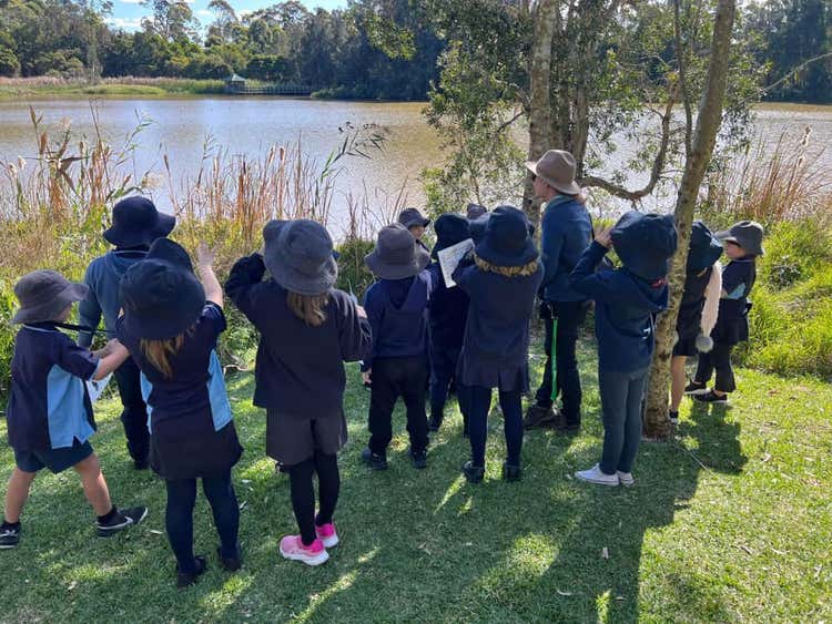 Students on excursion by the river